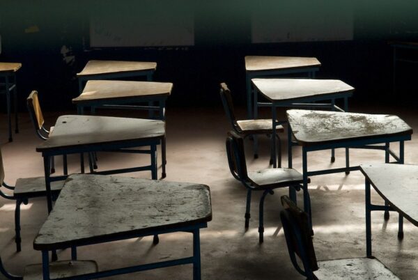 Empty desks lined up in a classroom